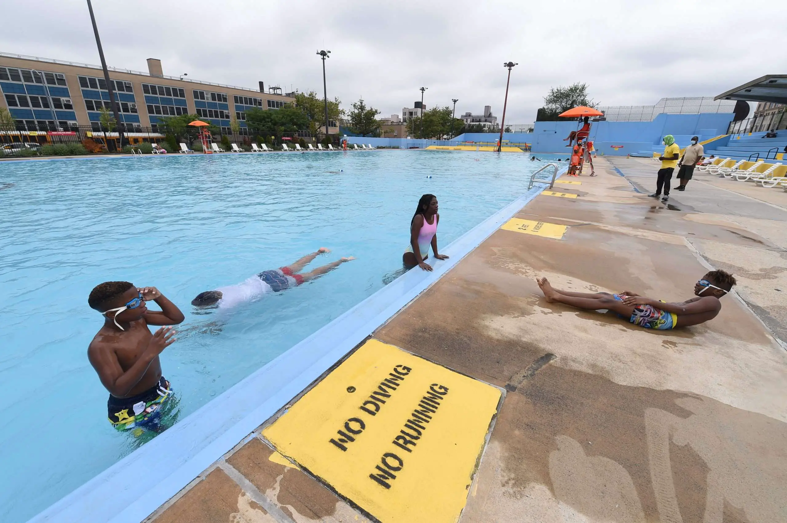 Eight New York City pools open, but rain kept crowds small ...