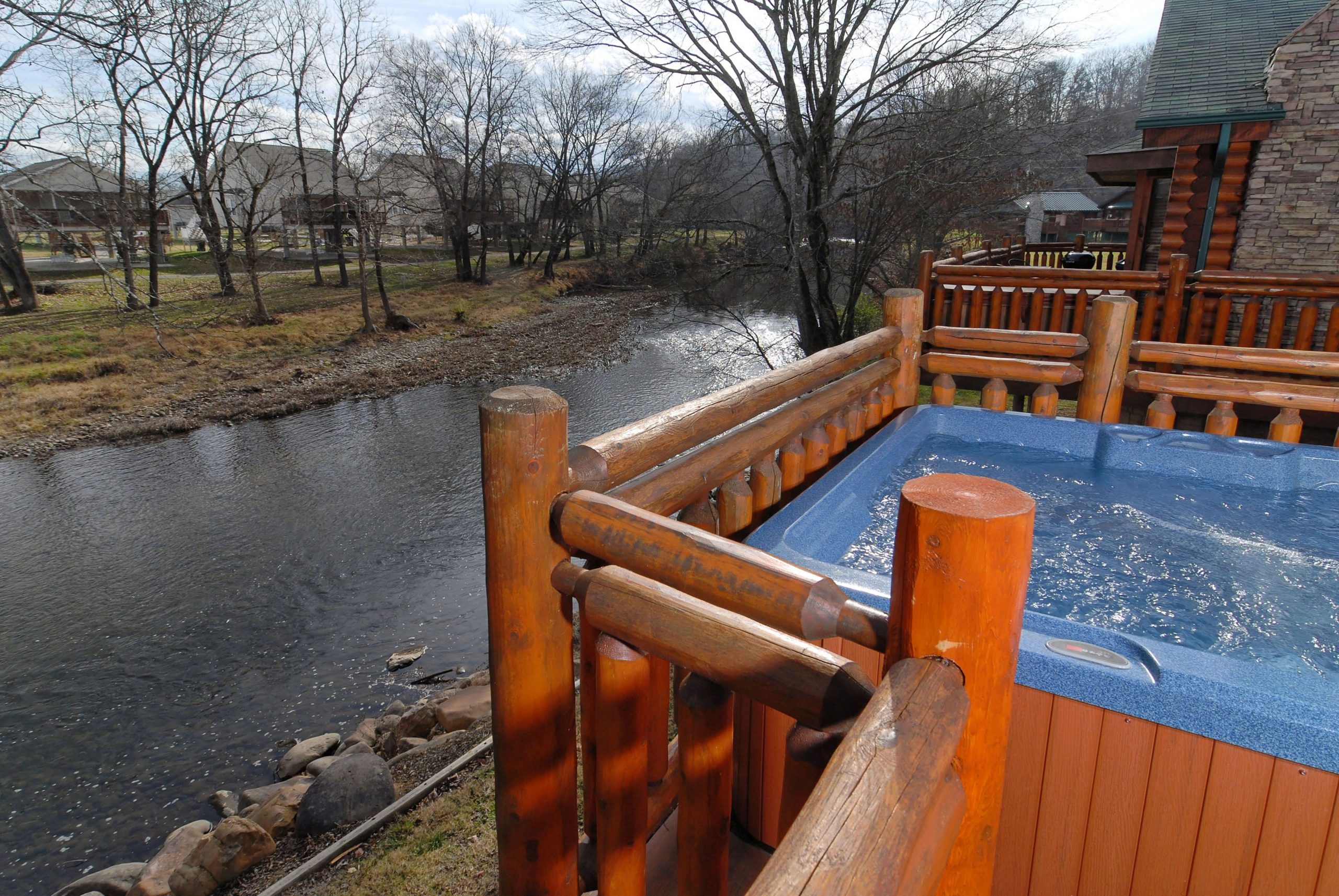 Pigeon Forge Tennessee River Cabin that features a hot tub and fire pit ...