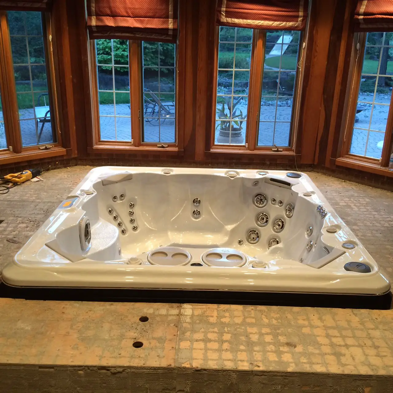 Planning on installing your hot tub indoors? Build up around the ...