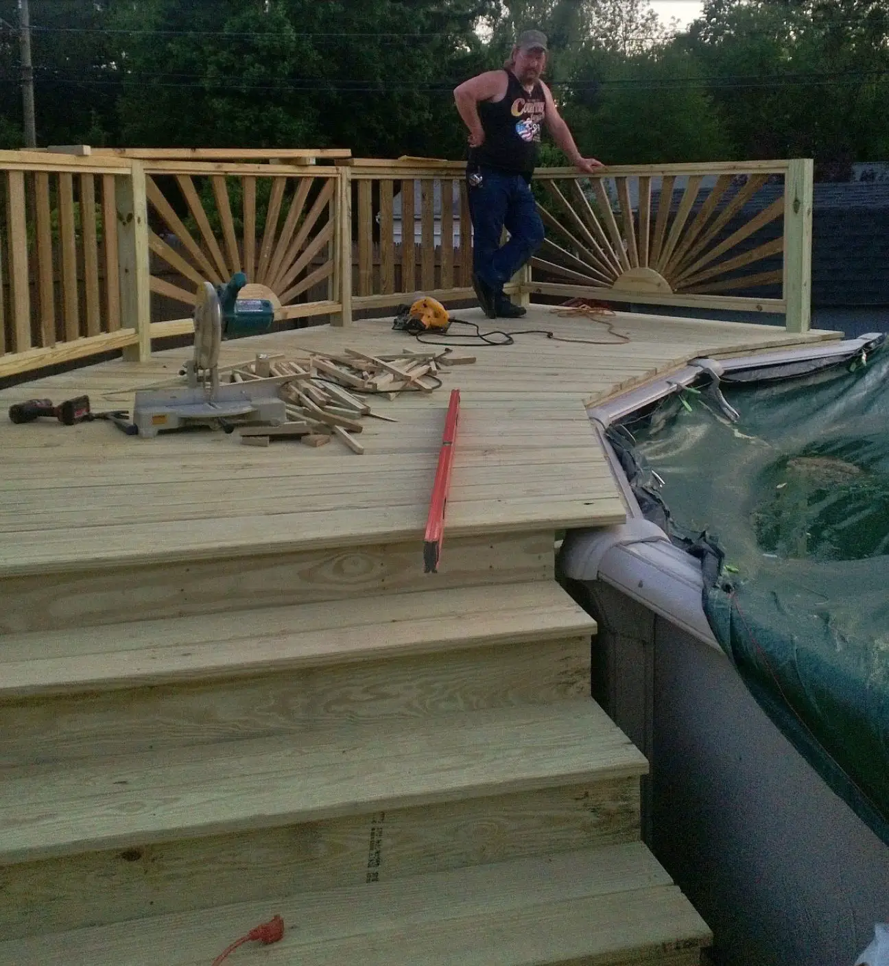 Railing...love it Above ground pool deck. sunburst railing.